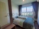 Cozy bedroom with natural light and a large window