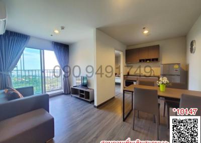 Spacious living room with modern furniture and balcony access