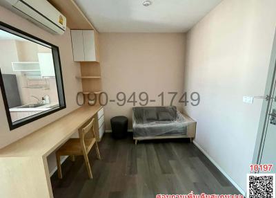 Compact bedroom with built-in desk and wardrobe