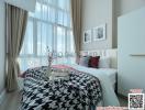 Bright Bedroom with Large Window and City View