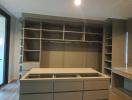 Spacious bedroom with built-in wardrobe and ample shelving