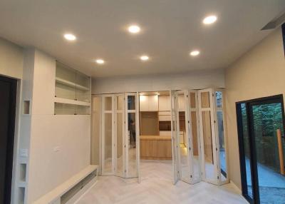 Unfinished interior of a residential construction showing wall studs and open space