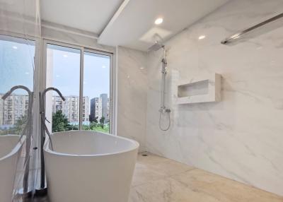 Modern bathroom with a freestanding tub and rainfall shower