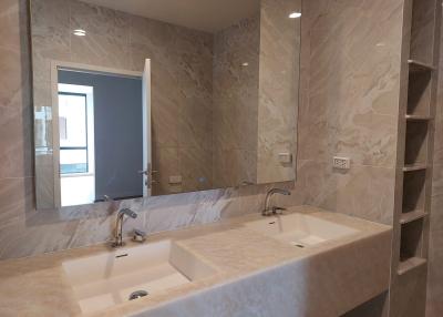 Modern bathroom with double sink and marble finish