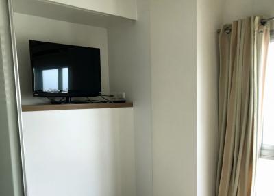 TV and shelving unit in a modern living space with natural light