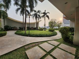 Open green space with walking paths in a residential complex