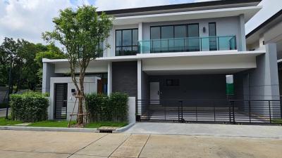 Modern two-story house with balcony and garage front view