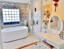 Elegant bathroom with freestanding tub and artistic wall tiles