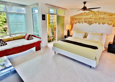 Spacious and bright bedroom with a king-sized bed and modern decor