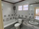 Modern bathroom with bathtub and neutral color tiles