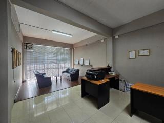 Spacious living room with modern furniture and ample natural light