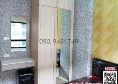 Compact bedroom interior with built-in wardrobe and granite flooring