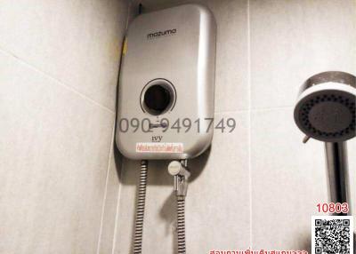 Electric water heater and showerhead in bathroom