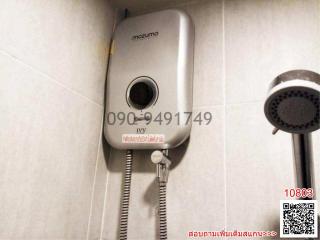 Electric water heater and showerhead in bathroom