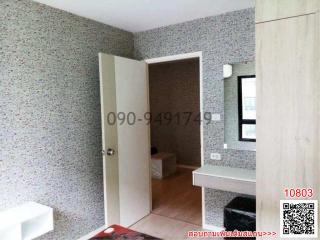 Compact bedroom with terrazzo walls and built-in counter