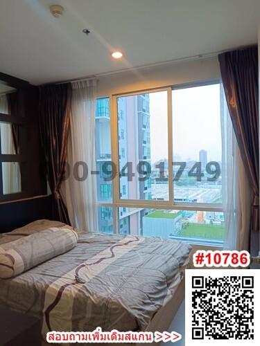 Contemporary bedroom with a view of the city and natural light