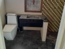 Unfinished bathroom with toilet and vanity under construction