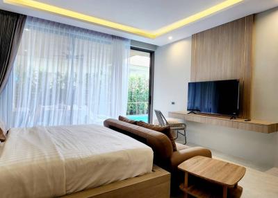 Modern bedroom with natural light and sleek design