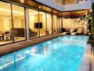 Luxurious house with illuminated pool during twilight