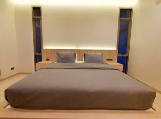 Modern bedroom with a large bed and minimalist design