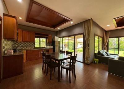 Spacious open floor plan with combined kitchen, dining, and living area