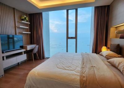 Modern bedroom with ocean view and stylish interior design