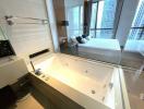 Modern bathroom with Jacuzzi tub and skyline views