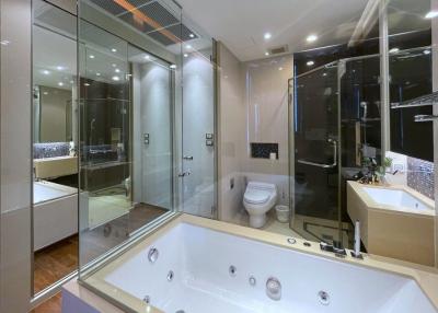 Modern bathroom with jacuzzi tub and glass shower