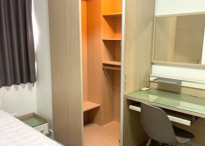 Compact bedroom with wardrobe and study desk