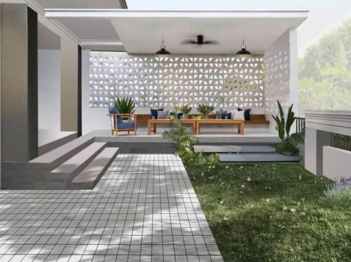 Modern outdoor patio with seating and decorative wall