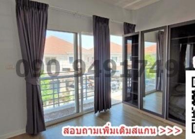 Spacious bedroom with natural light and balcony access