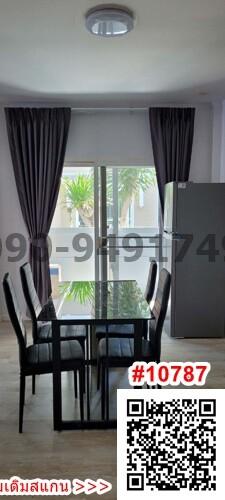 Modern dining area with glass-top table and window view