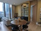 Contemporary living room with dining area and balcony access in a modern apartment