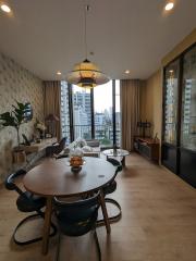 Modern living room with dining area and city view