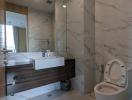 Modern bathroom interior with marble tiles and floating vanity