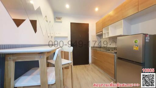 Compact studio apartment interior with integrated kitchen space