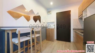 Modern kitchen with bar table and stools