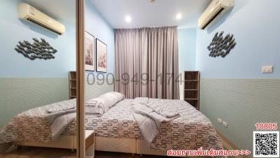 Spacious bedroom with queen-size bed and modern decor