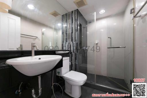 Modern bathroom interior with glass shower stall