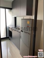 Modern kitchen with stainless steel appliances and gray cabinetry