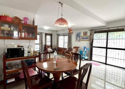 Spacious dining room with large windows and ample natural light