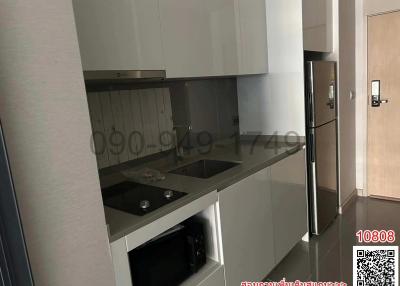 Modern kitchen with stainless steel appliances and white cabinetry