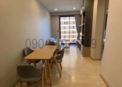 Modern dining area inside an apartment with natural light