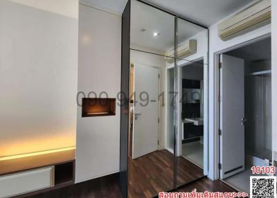 Modern bedroom with mirrored wardrobe and ambient lighting