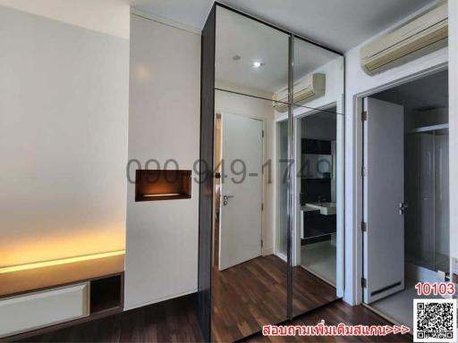 Modern bedroom with mirrored wardrobe and ambient lighting