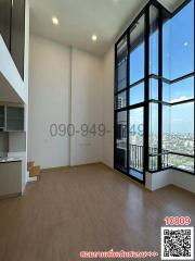 Modern high-rise apartment room with large windows and city view