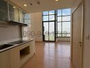 Spacious kitchen with large windows and ample natural light