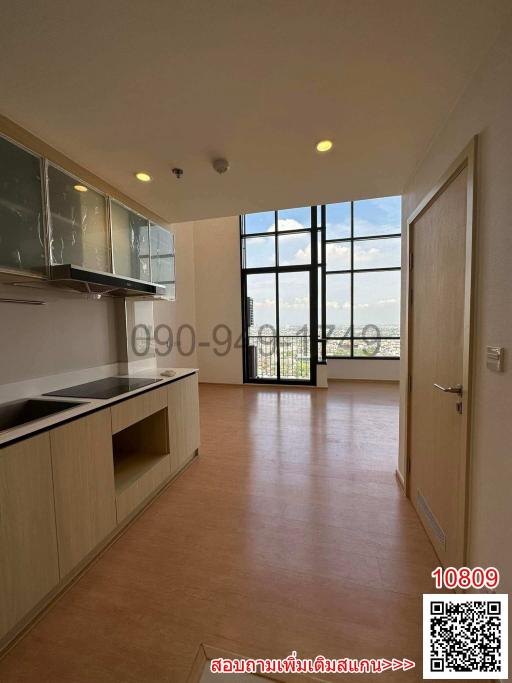 Spacious kitchen with large windows and ample natural light