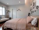 Cozy modern bedroom with a double bed and stylish wall decor