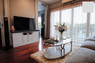 Spacious living room with natural light and modern decor